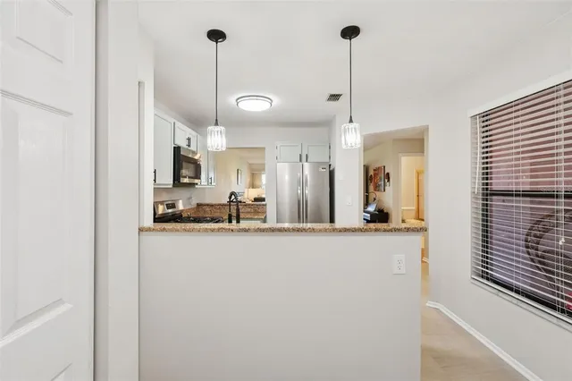 a view of a living room and a kitchen