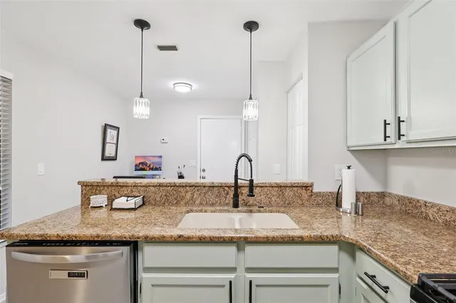 a kitchen with sink and window