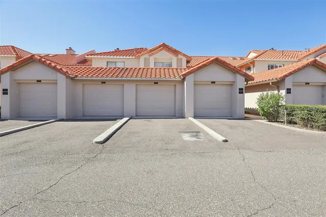 a front view of a house with a garage