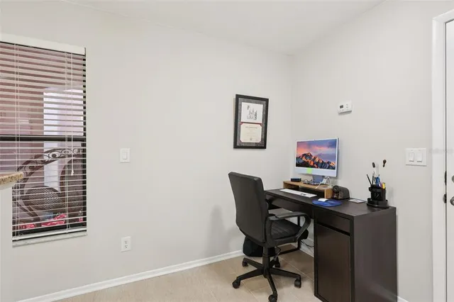 a view of a workspace with furniture