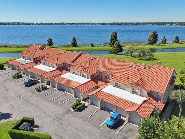 an aerial view of a house with outdoor space