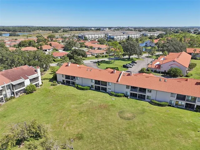 an aerial view of residential houses and city street