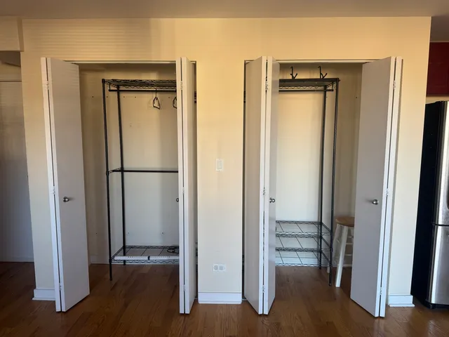 a view of hallway with wooden floor