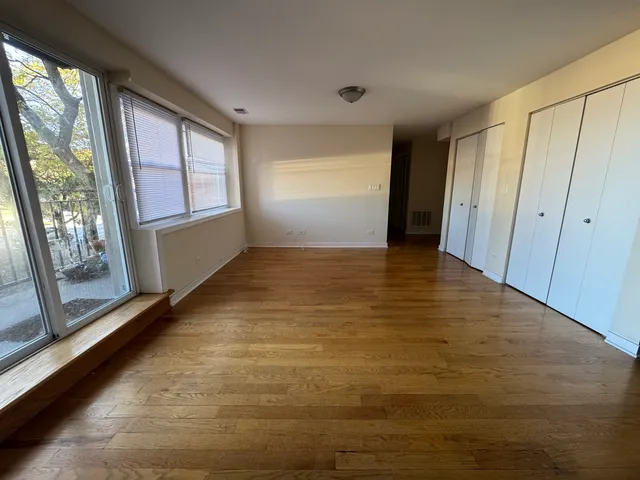 a view of an empty room with a window