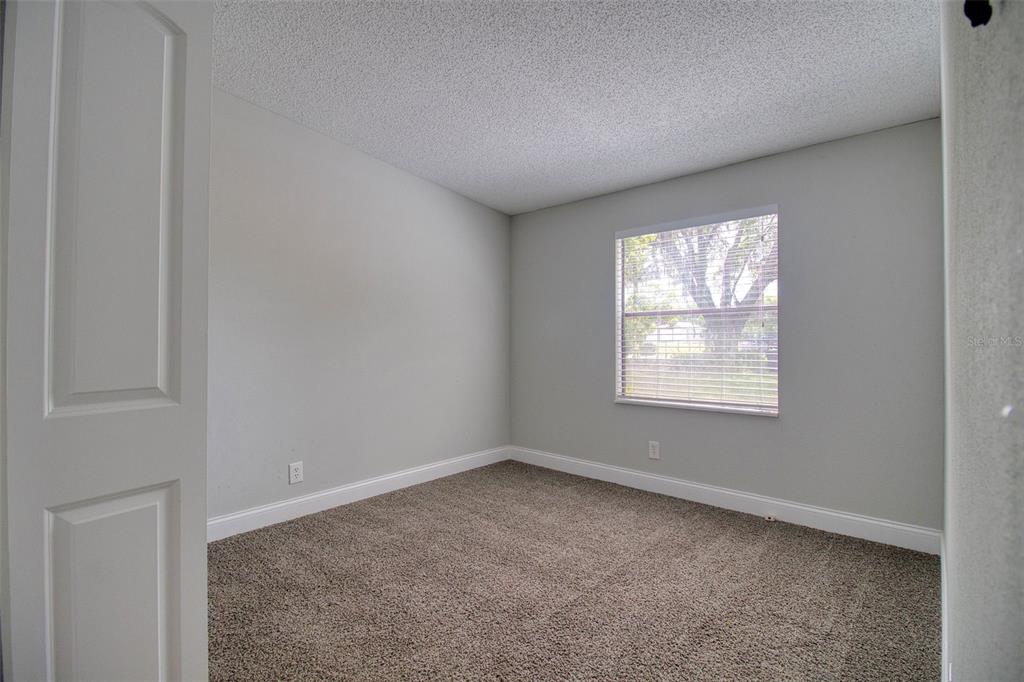 6804 Stafford Road Plant City, FL 33565 - Photo 11 of 24 an empty room with windows