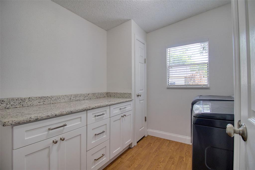 6804 Stafford Road Plant City, FL 33565 - Photo 16 of 24 a bathroom with a granite countertop sink and a mirror
