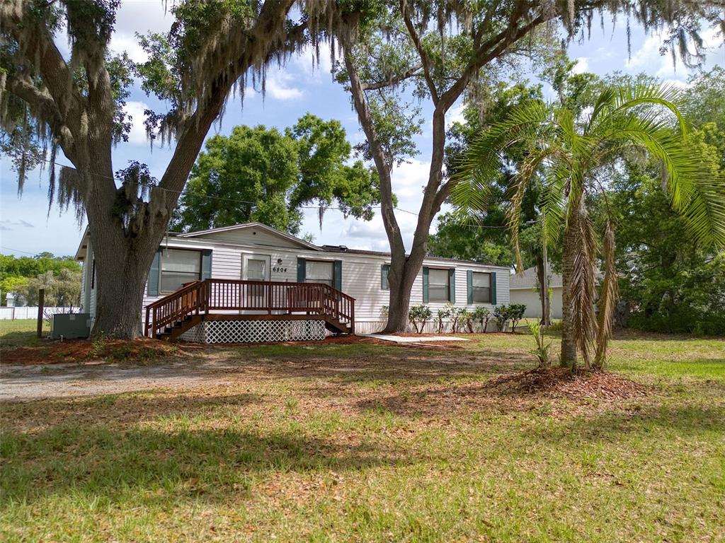 6804 Stafford Road Plant City, FL 33565 - Photo 2 of 24 a view of a house with a yard