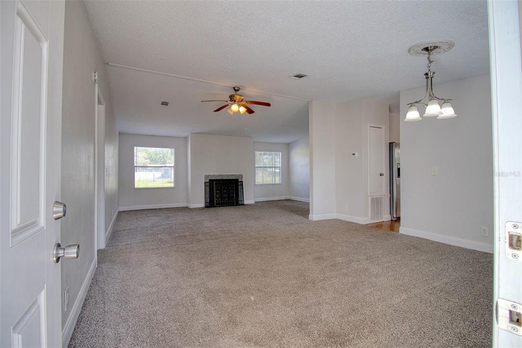 6804 Stafford Road Plant City, FL 33565 - Photo 3 of 24 a view of empty room with window and fireplace