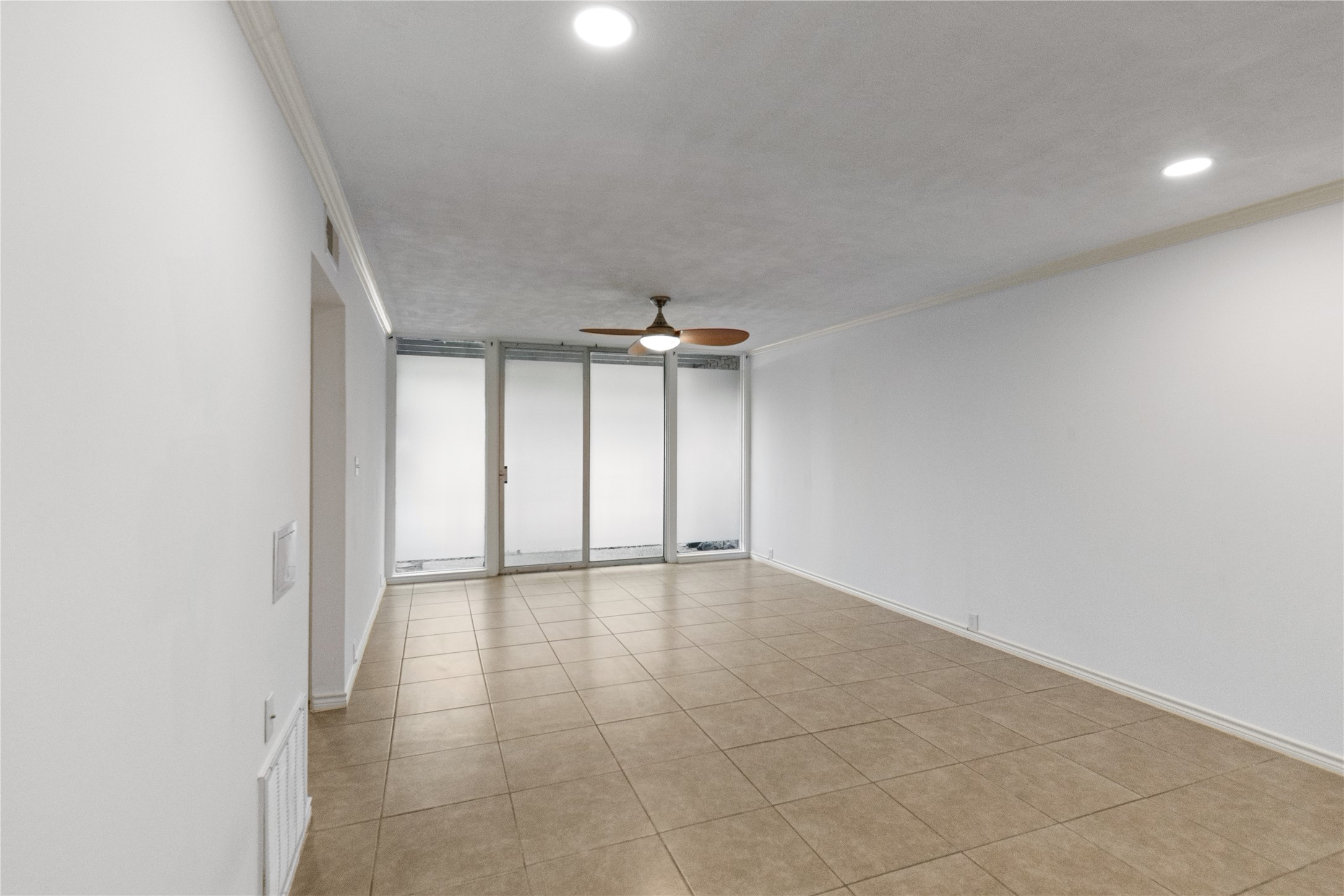 5353 Institute Lane, Unit 12 Houston, TX 77005 - Photo 3 of 15 wooden floor in an empty room with a window