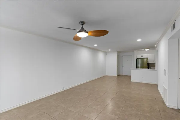 a kitchen with stainless steel appliances a refrigerator stove microwave and sink