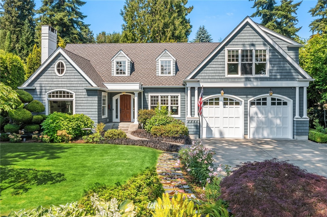 5544 Northeast Penrith Road Seattle, WA 98105 - Photo 1 of 1 a front view of a house with a yard and garage