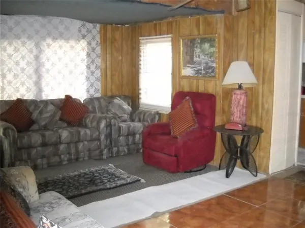 a kitchen with stainless steel appliances granite countertop a refrigerator and a stove