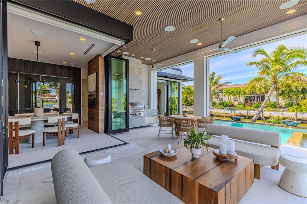 1100 Sandpiper Street Naples, FL 34102 - Photo 14 of 47 View of patio with area for grilling with wolf grill