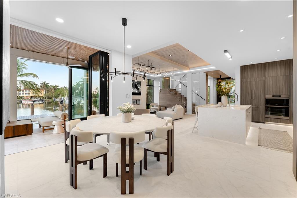 1100 Sandpiper Street Naples, FL 34102 - Photo 21 of 47 a view of a dining room and livingroom view