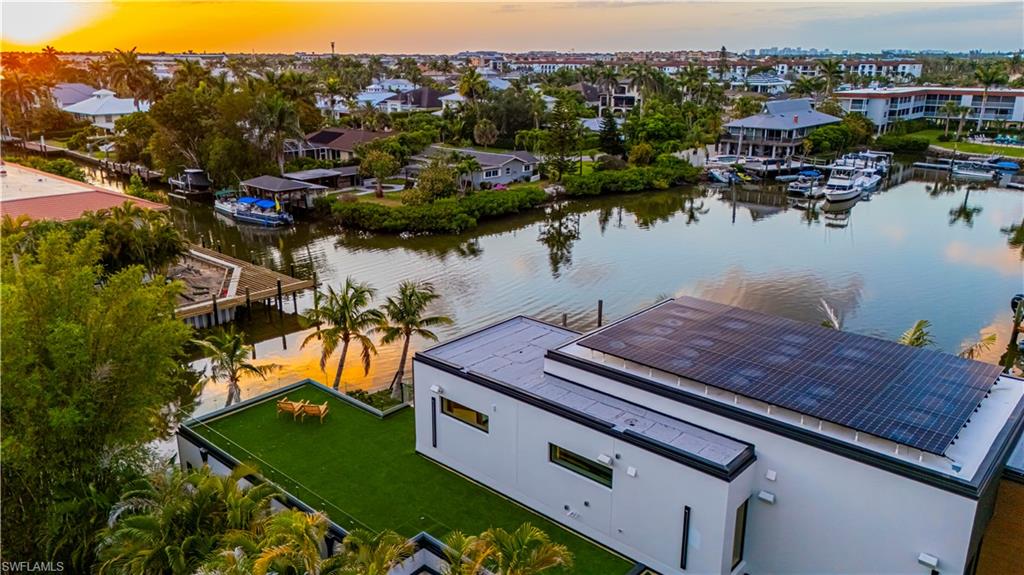 1100 Sandpiper Street Naples, FL 34102 - Photo 46 of 47 an aerial view of a house with a yard