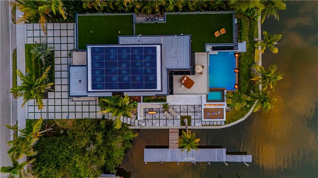 1100 Sandpiper Street Naples, FL 34102 - Photo 8 of 47 an aerial view of a house with garden space and street view