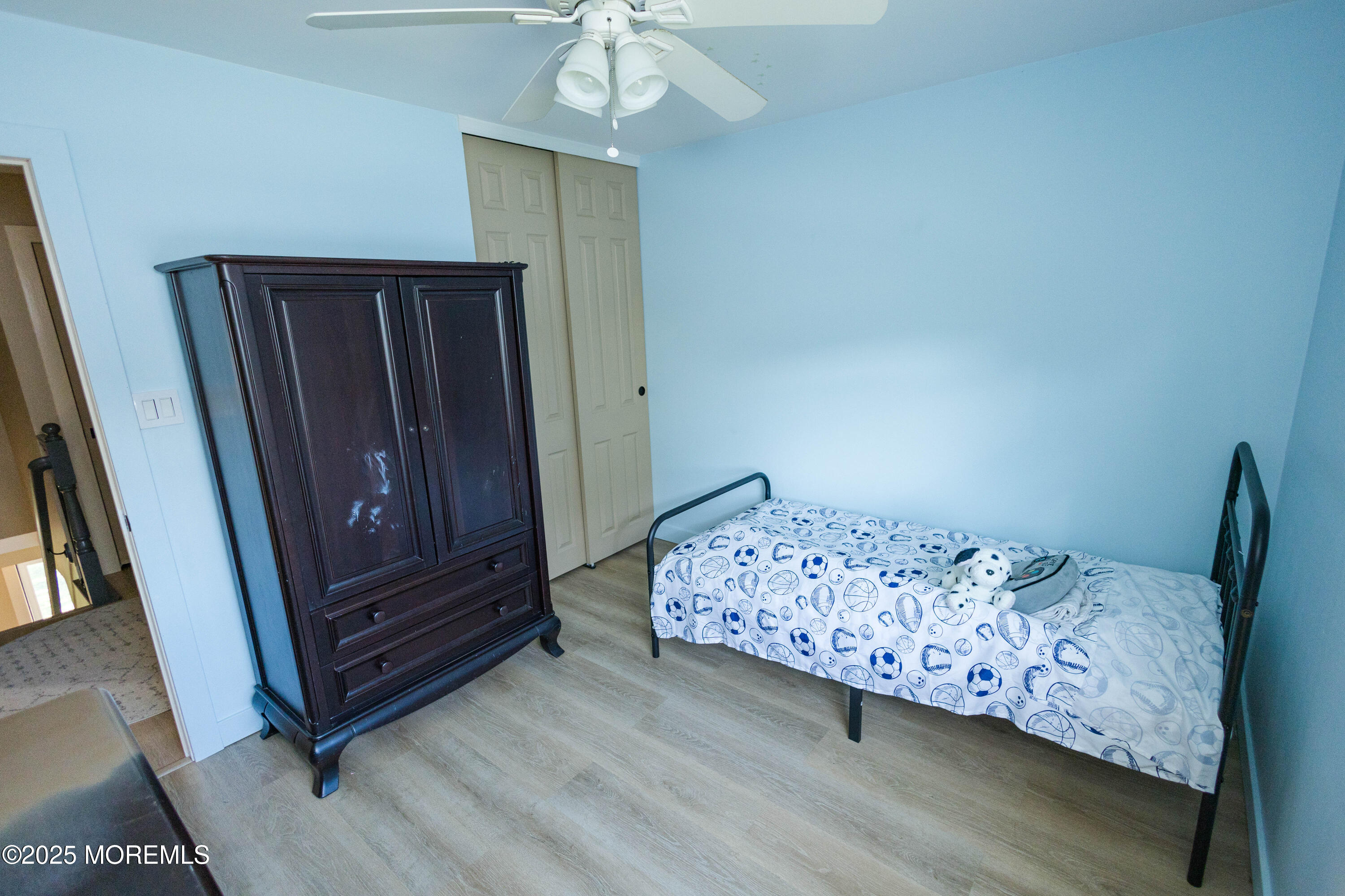 29 Snowdrift Lane Howell, NJ 07731 - Photo 27 of 32 a bedroom with a bed and wooden floor
