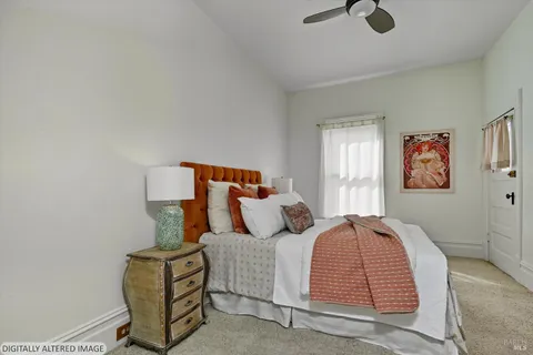 a bedroom with bed and window