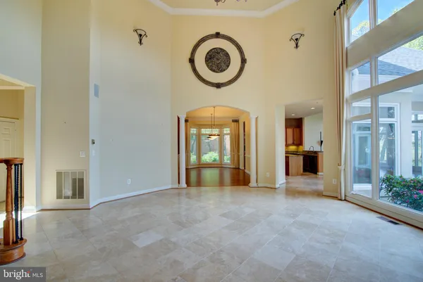 a bathroom with a granite countertop tub a sink and glass door