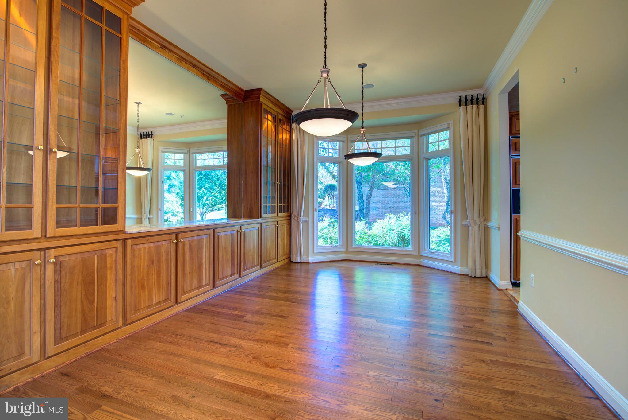43462 Firestone Place Leesburg, VA 20176 - Photo 23 of 80 a view of an entryway with wooden floor and windows