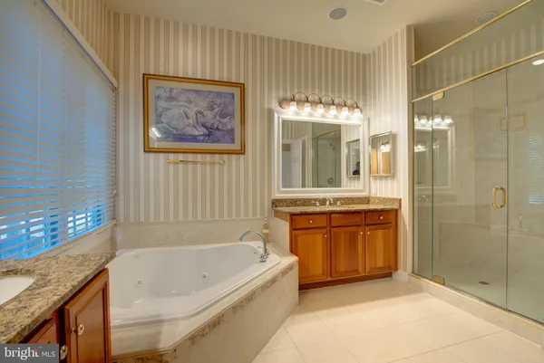 a view of empty room with kitchen and window