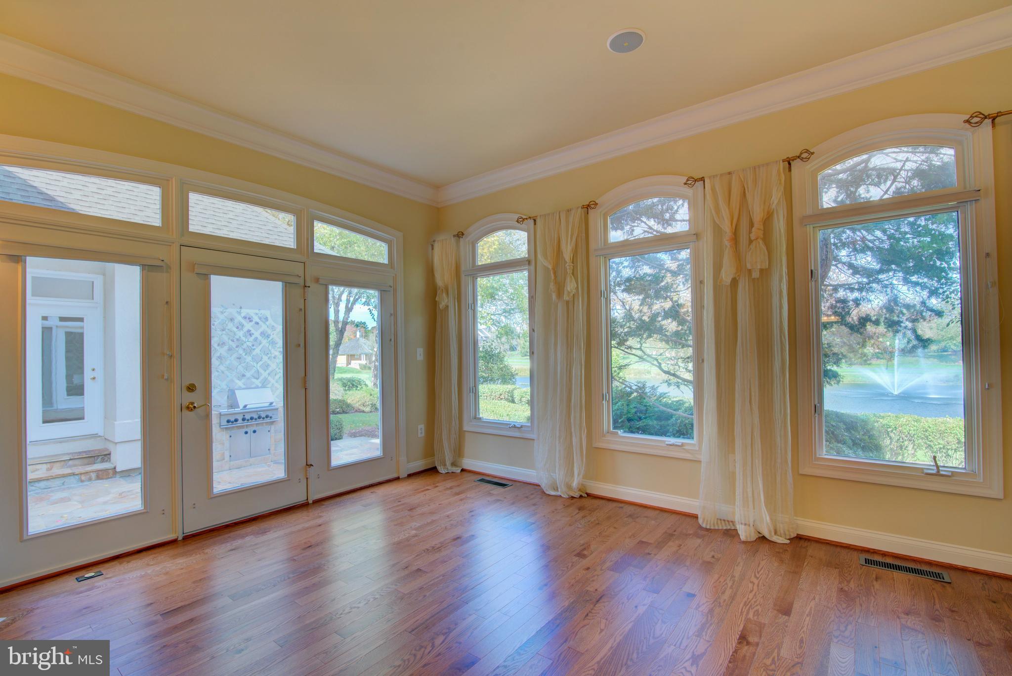 43462 Firestone Place Leesburg, VA 20176 - Photo 30 of 80 a view of an entrance with wooden floor and windows
