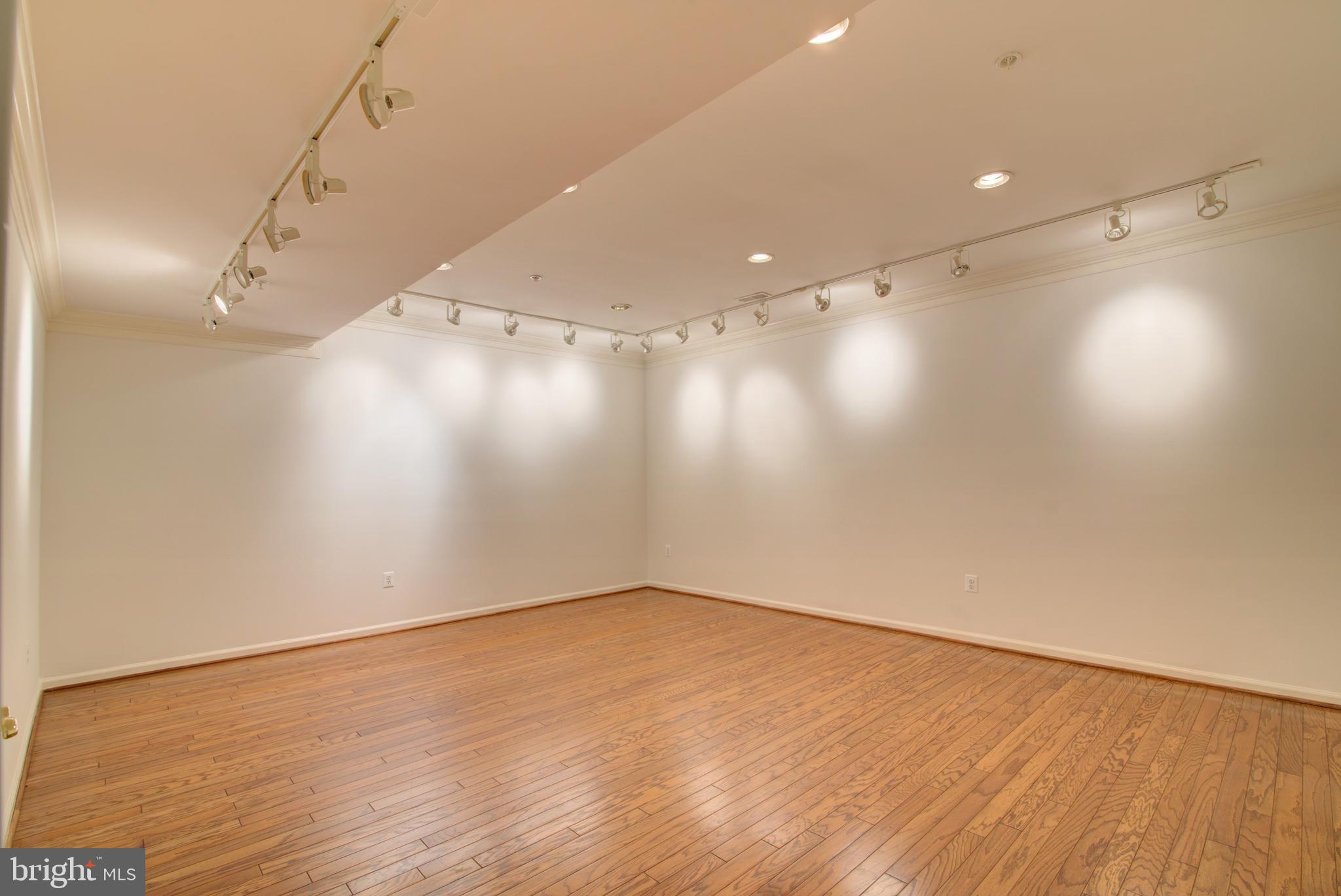 43462 Firestone Place Leesburg, VA 20176 - Photo 41 of 80 an empty room with wooden floor and windows