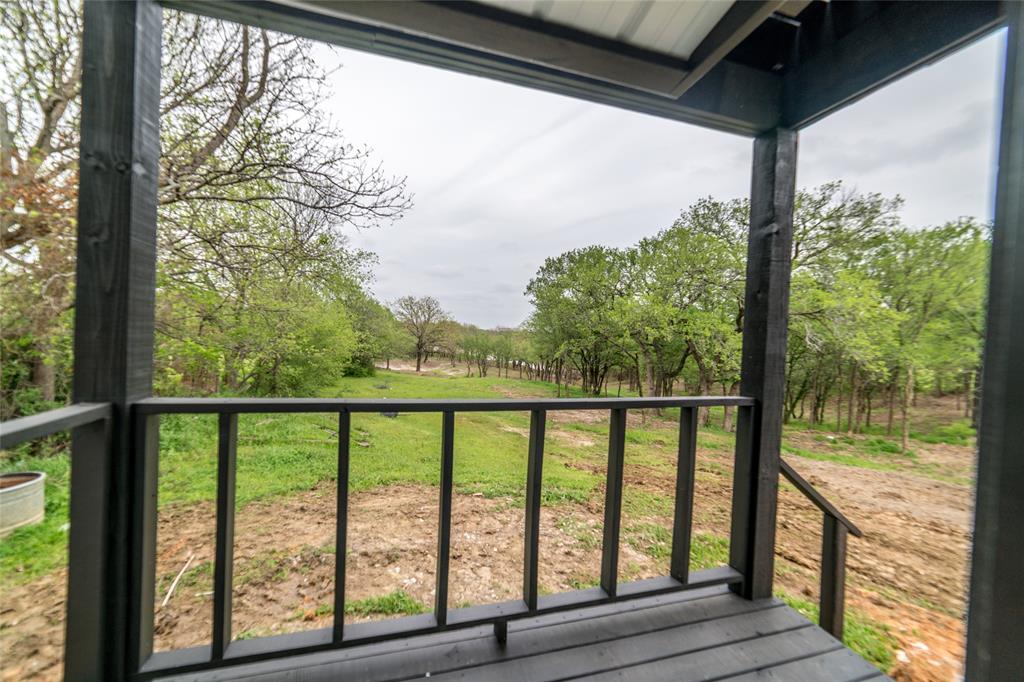 956 Lloyd's Road Little Elm, TX 75068 - Photo 7 of 18 Rear porch from bedroom 1