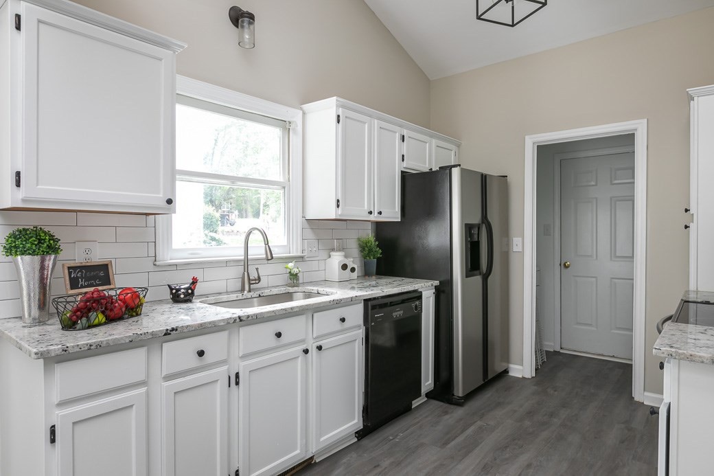 5307 Reams Run Road Durham, NC 27713 - Photo 6 of 18 Bright white cabinets and newer appliances. Kitchen