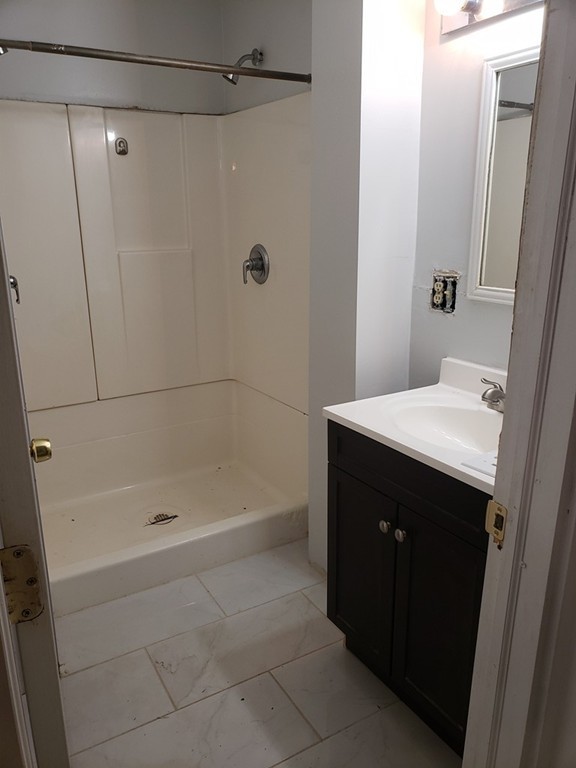 101 Podunk Road East Brookfield, MA 01515 - Photo 8 of 24 a bathroom with a bathtub and a sink