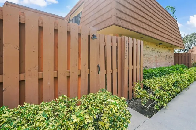 a view of a backyard with potted plants