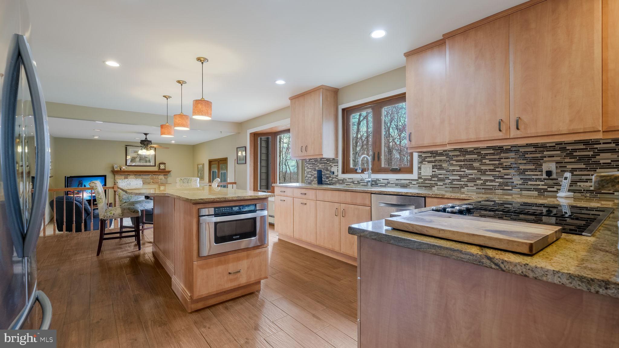 35 Declaration Drive Newtown, PA 18940 - Photo 14 of 53 a kitchen with stainless steel appliances granite countertop a sink and cabinets
