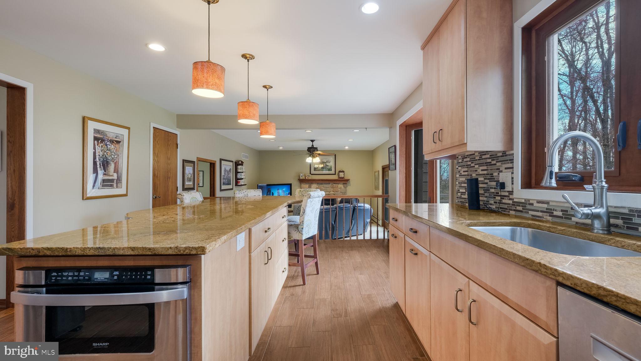 35 Declaration Drive Newtown, PA 18940 - Photo 15 of 53 a kitchen with stainless steel appliances granite countertop a stove and cabinets