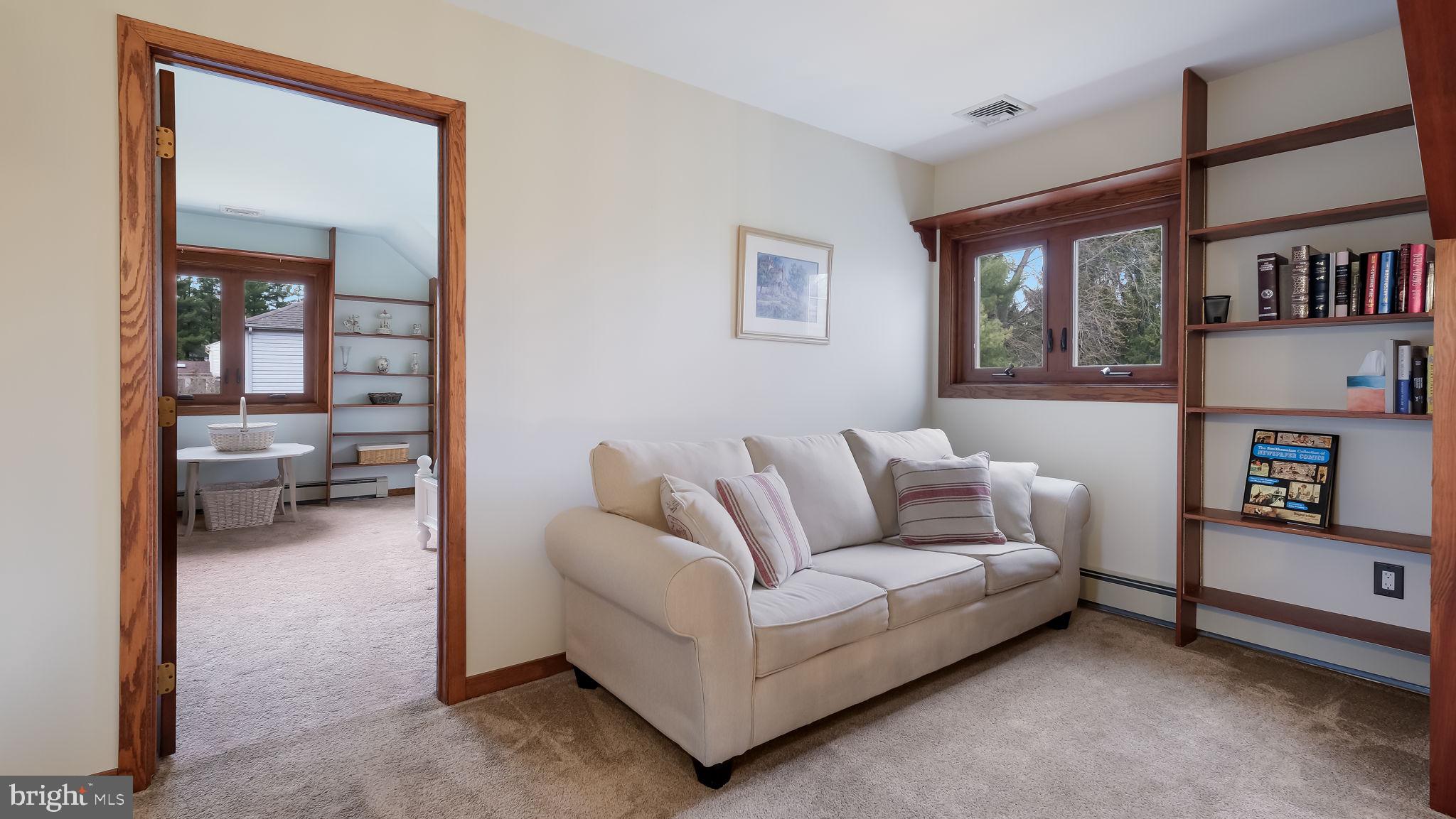 35 Declaration Drive Newtown, PA 18940 - Photo 21 of 53 a living room with furniture and a book shelf
