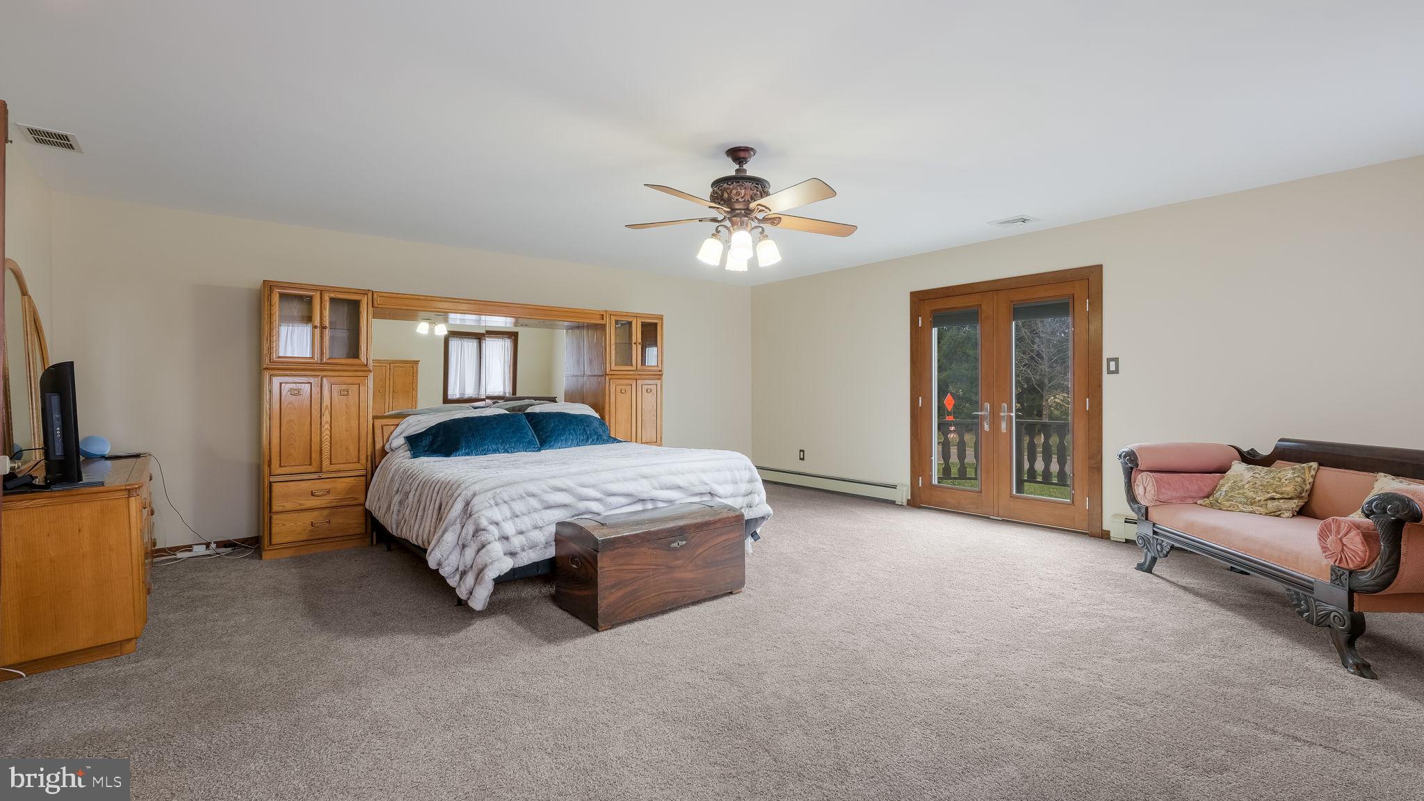 35 Declaration Drive Newtown, PA 18940 - Photo 30 of 53 a living room with furniture and a chandelier