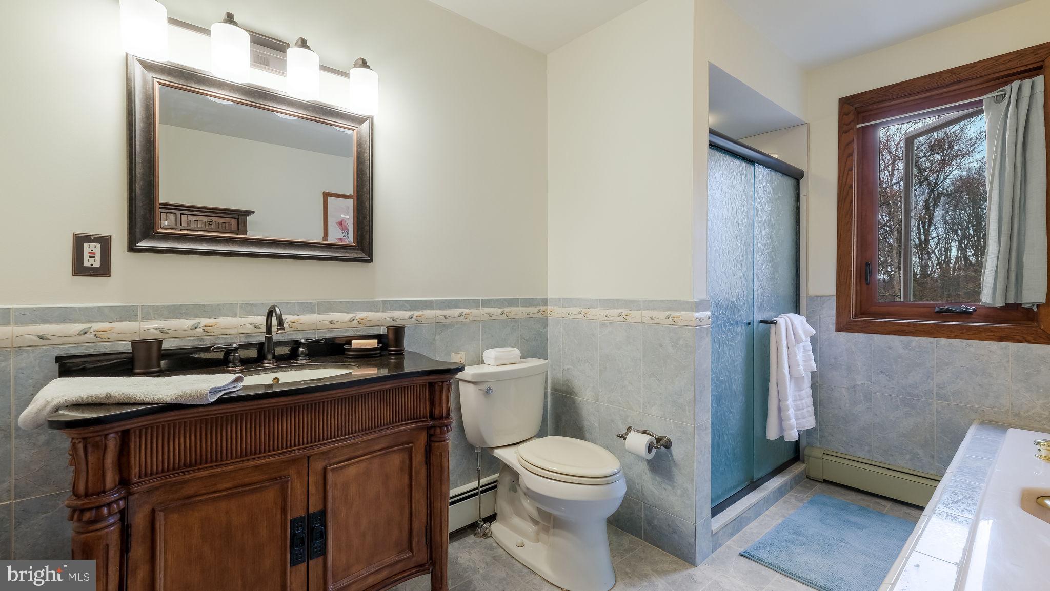 35 Declaration Drive Newtown, PA 18940 - Photo 33 of 53 a bathroom with a granite countertop toilet sink and mirror