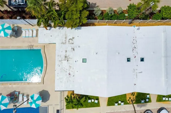 an aerial view of a house with a swimming pool