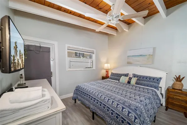 a bedroom with a bed and a dresser