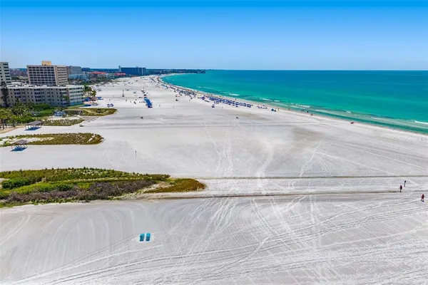 a view of an ocean beach and mountain view