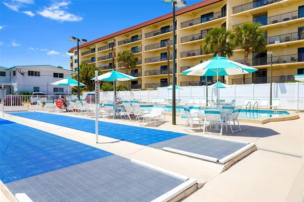 a view of pool with outdoor seating