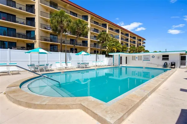 a view of a swimming pool with a patio