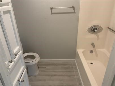 4226 Walnut Hills Drive, Unit 3 Corpus Christi, TX 78413 - Photo 10 of 11 a bathroom with a bathtub and a toilet