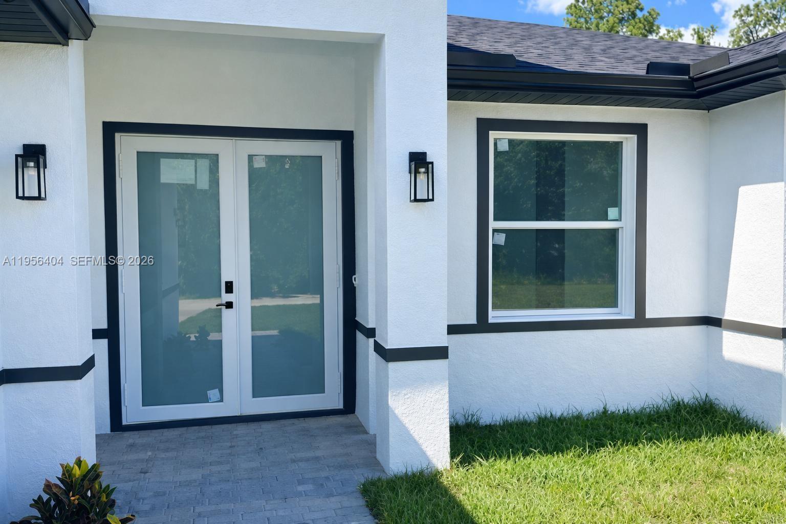 3901 East 19th Street Lehigh Acres, FL 33972 - Photo 11 of 11 front view of a house with a yard