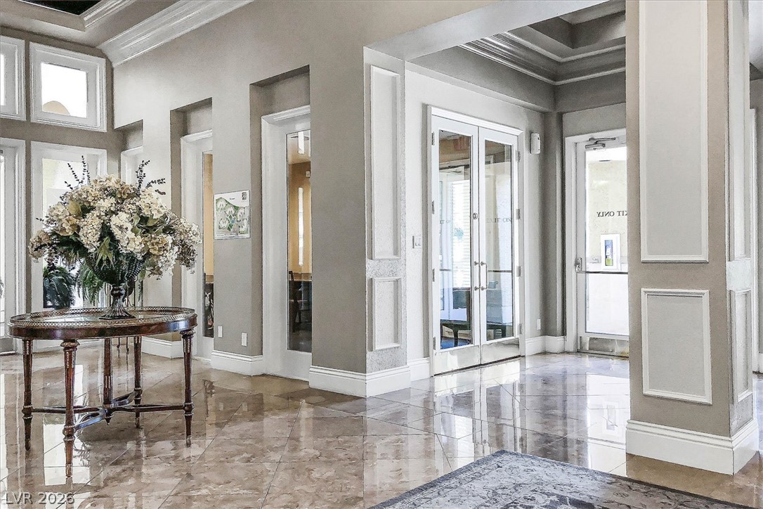 220 East Flamingo Road, Unit 305 Las Vegas, NV 89169 - Photo 19 of 26 A grand entrance welcomes all with polished marble floors and architectural trim throughout.