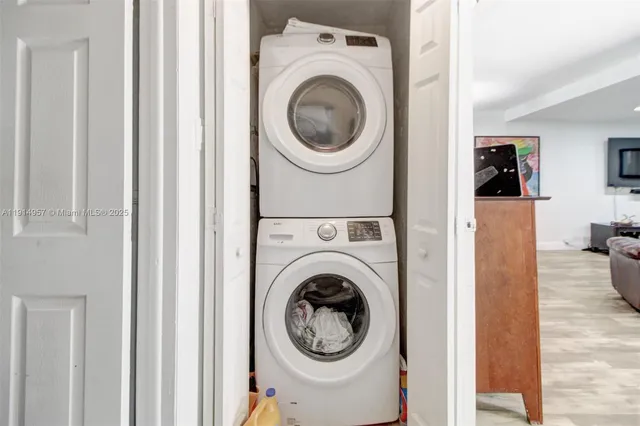 a view of a hallway with washer and dryer