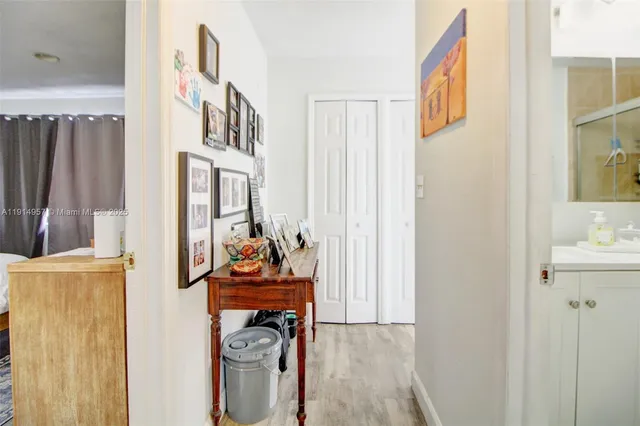 a view of a livingroom with storage and utility room