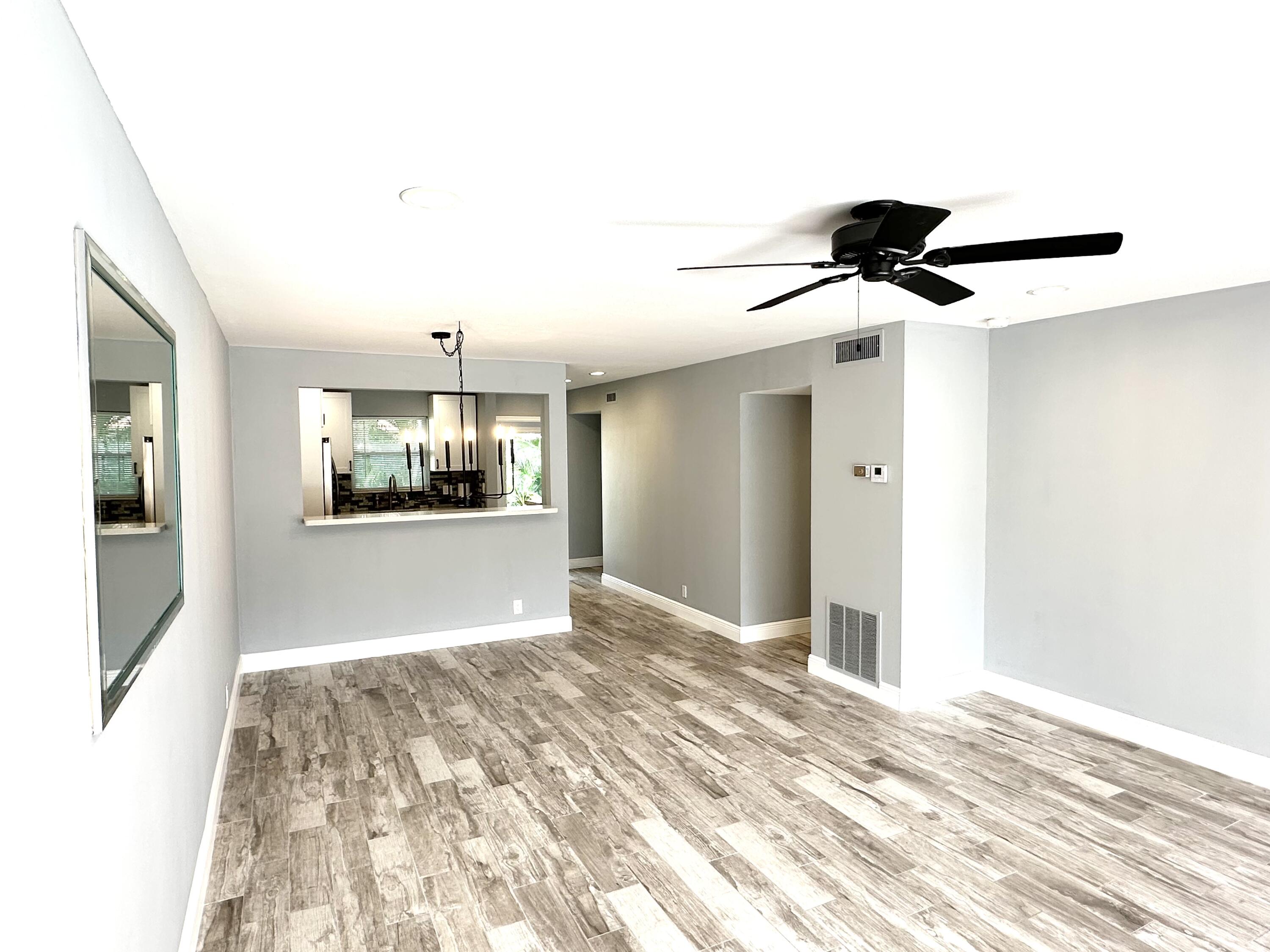 2162 Northeast 36th Street, Unit 46 Lighthouse Point, FL 33064 - Photo 5 of 15 a view of livingroom with furniture and window