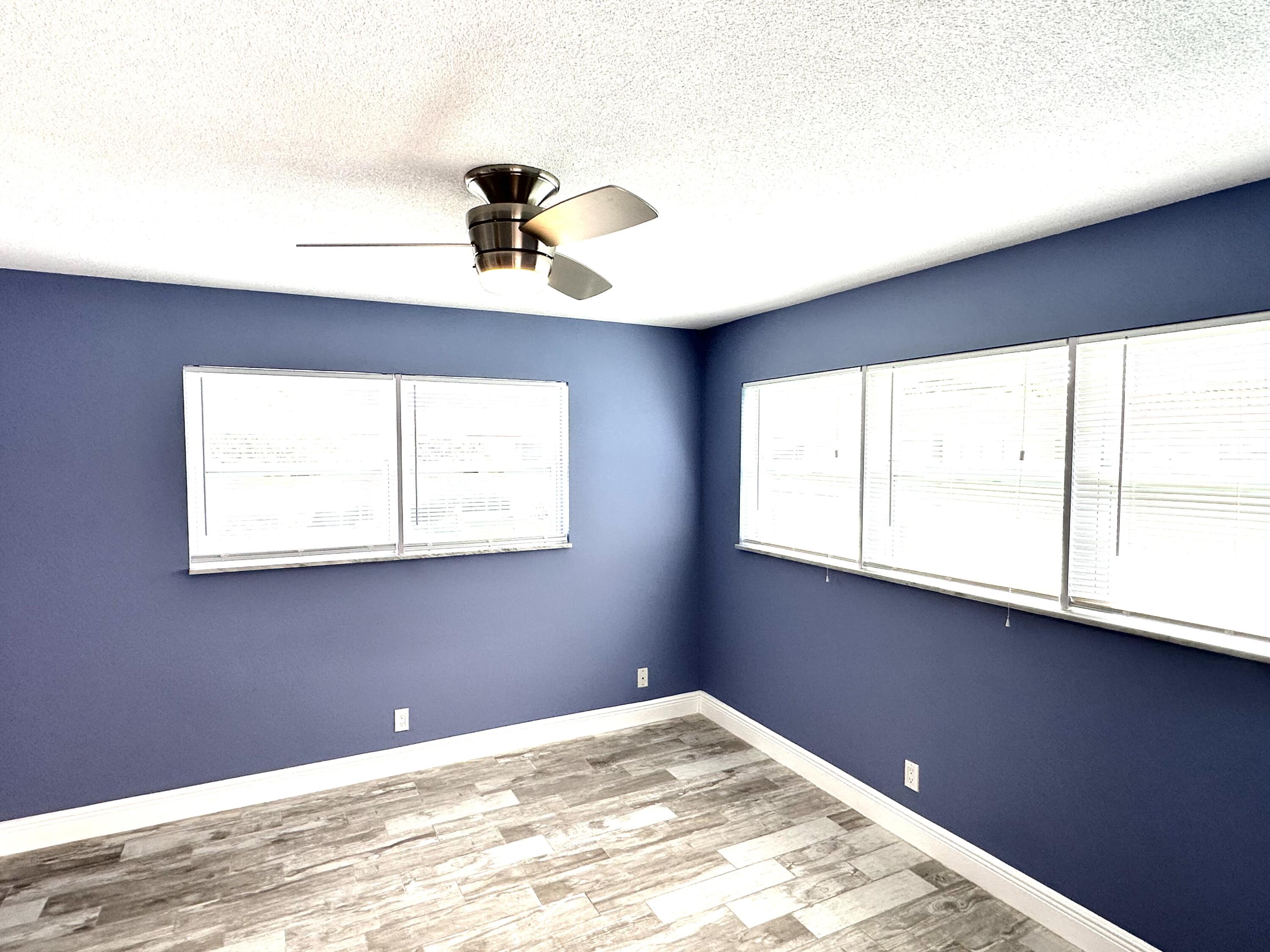 2162 Northeast 36th Street, Unit 46 Lighthouse Point, FL 33064 - Photo 7 of 15 a view of a bedroom with a window