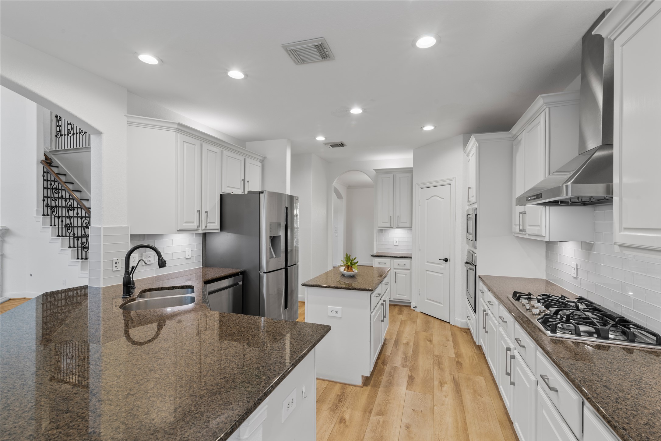 155 South Arrow Canyon Circle Spring, TX 77389 - Photo 11 of 49 a kitchen with stainless steel appliances granite countertop a sink stove and refrigerator