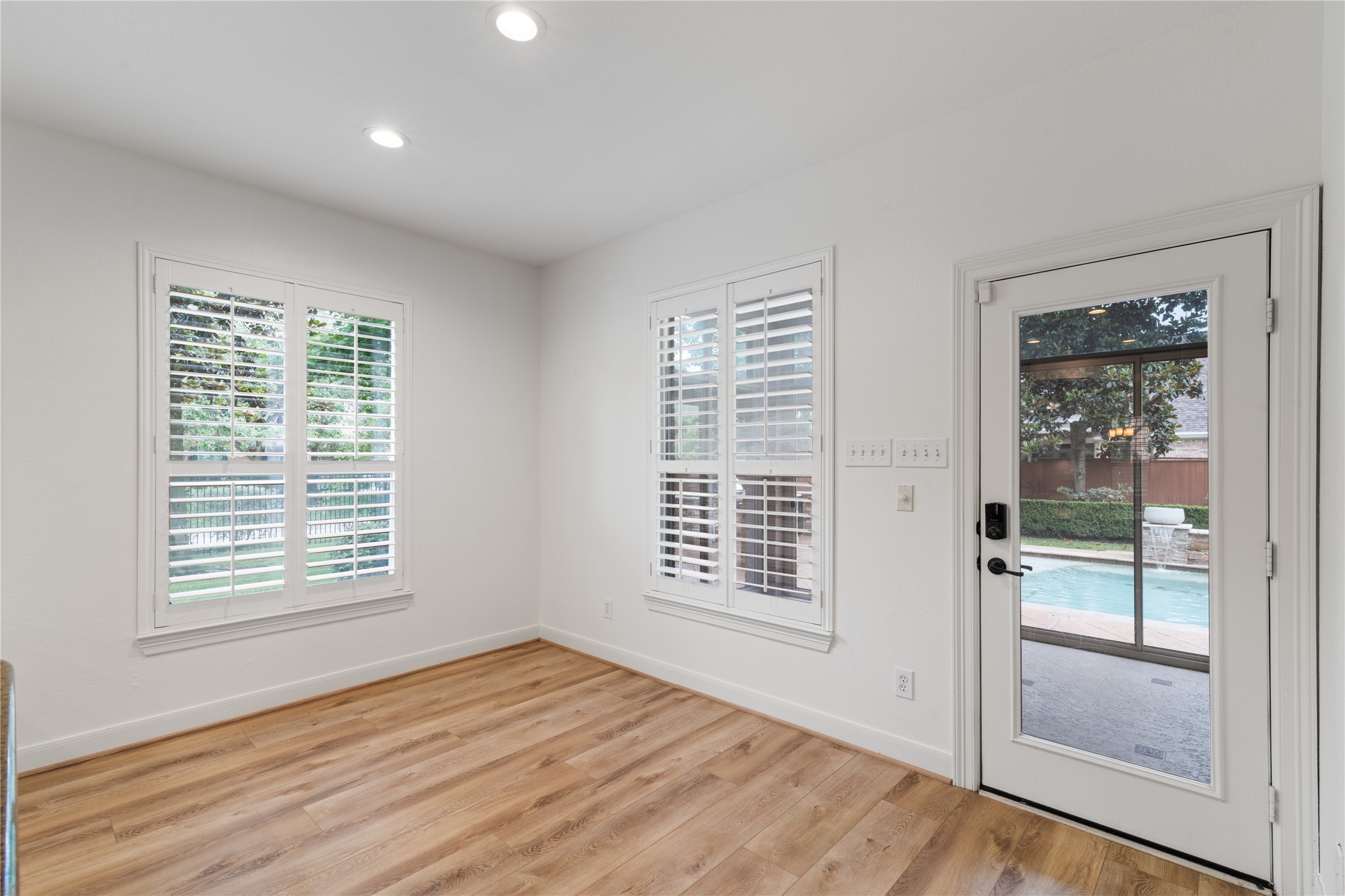 155 South Arrow Canyon Circle Spring, TX 77389 - Photo 13 of 49 a view of an empty room with a window and wooden floor